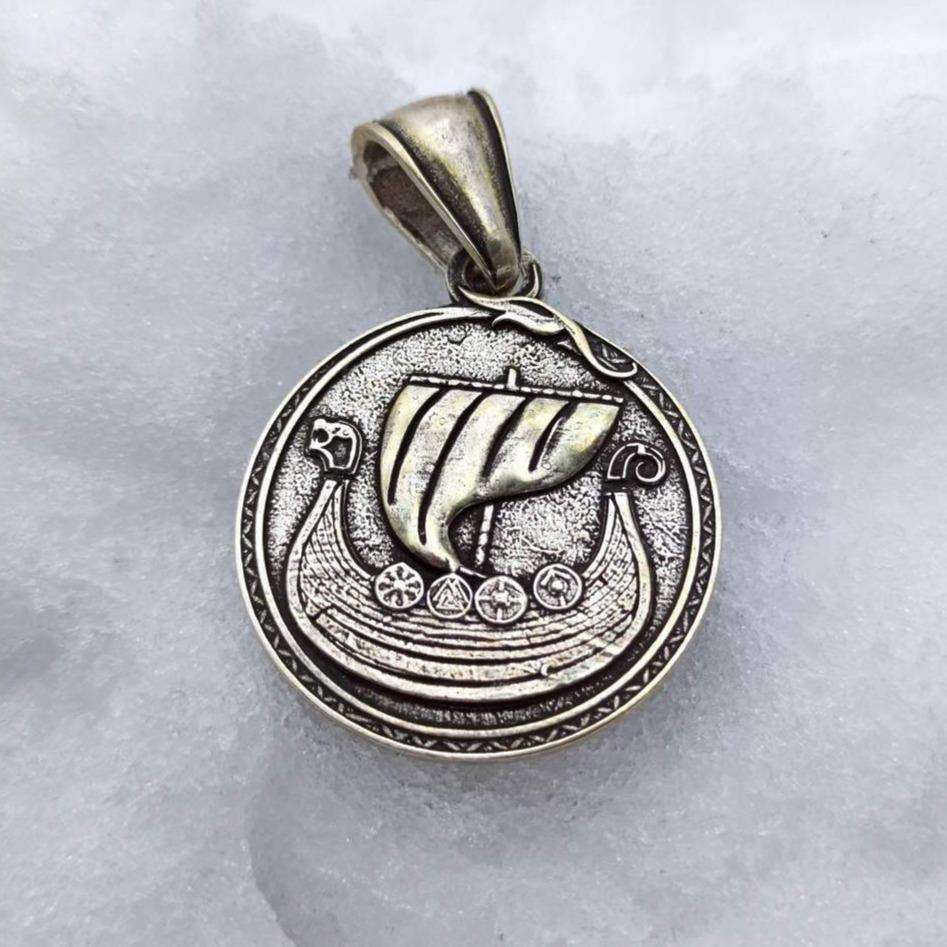 Viking long ship pendant with Vegvisir rune