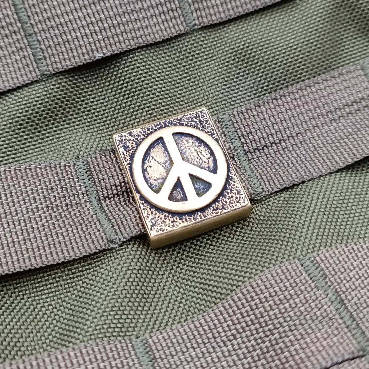Peace symbol molle clip