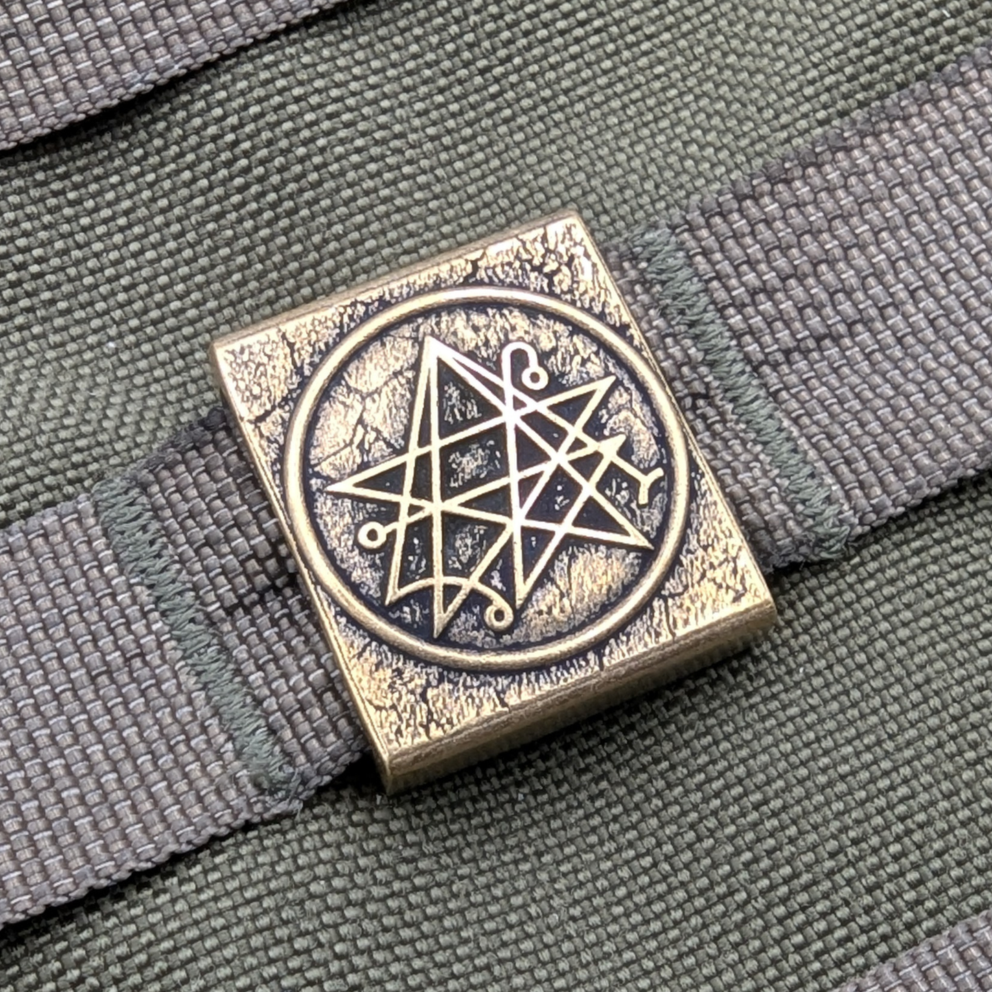 Necronomicon molle clip