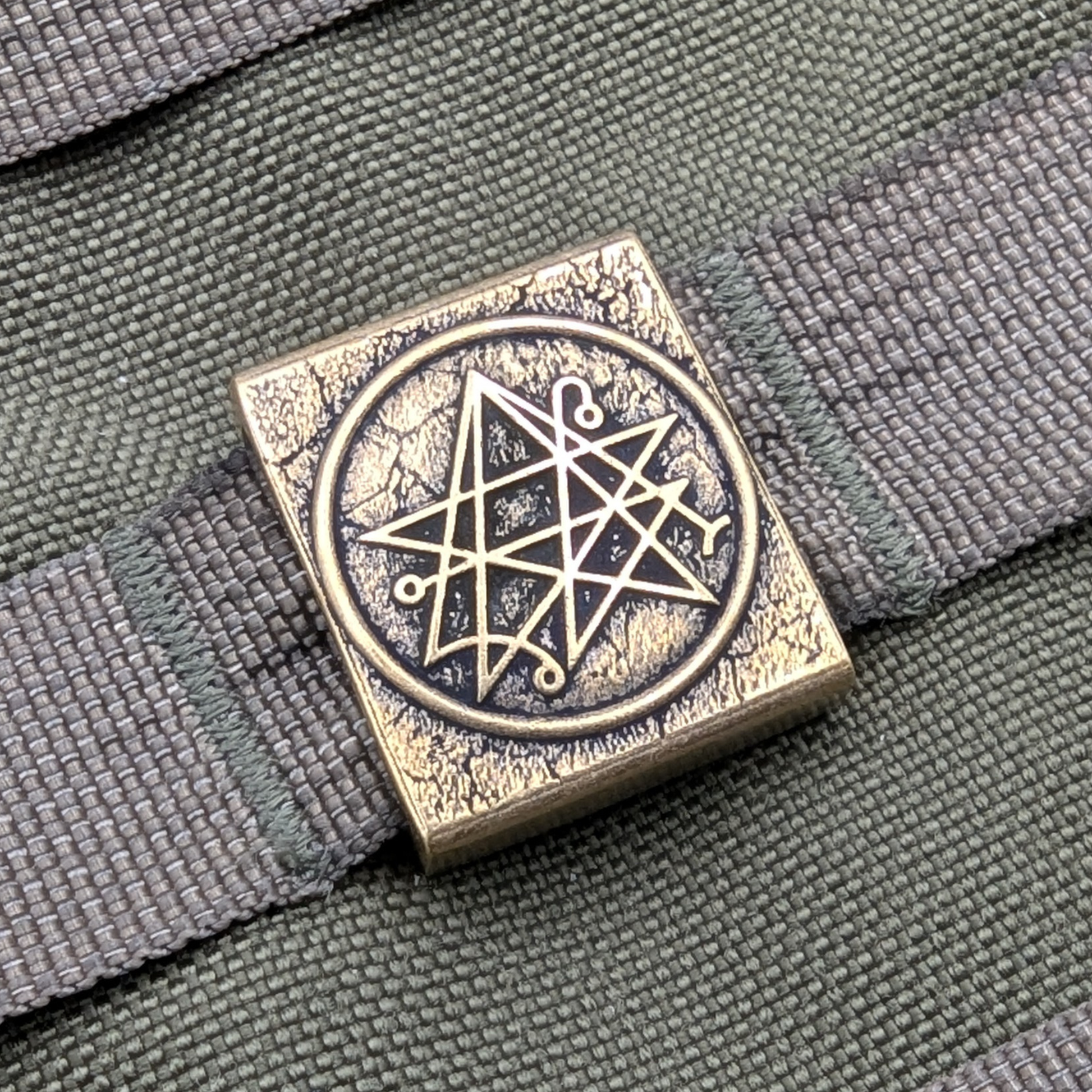 Necronomicon molle clip