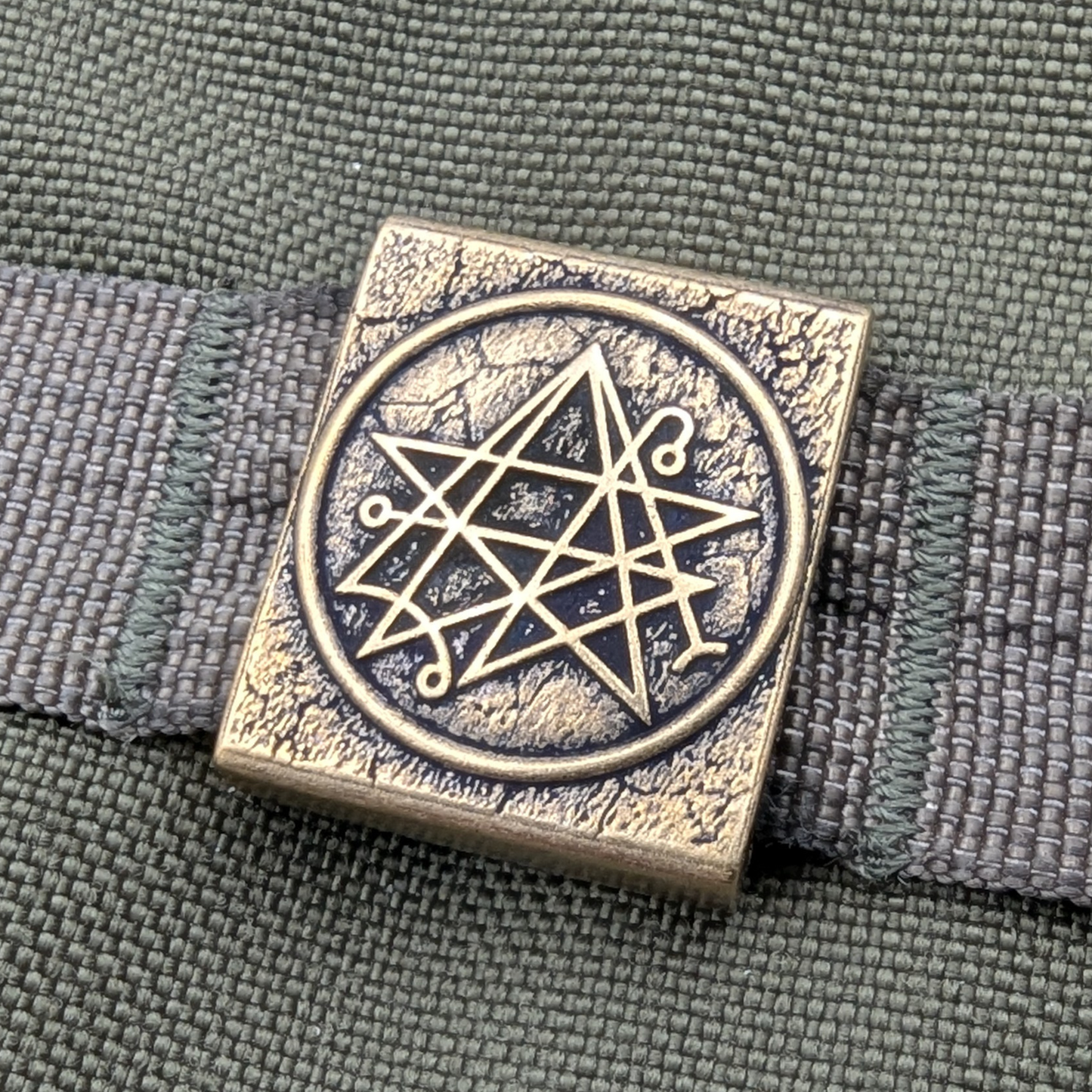 Necronomicon molle clip