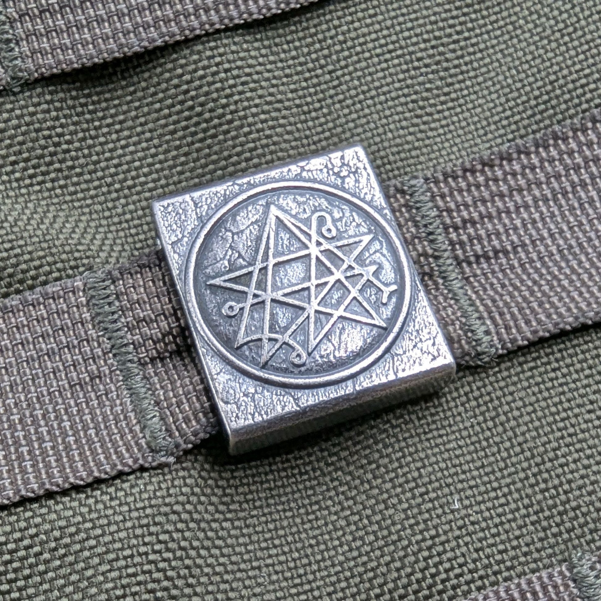 Necronomicon molle clip