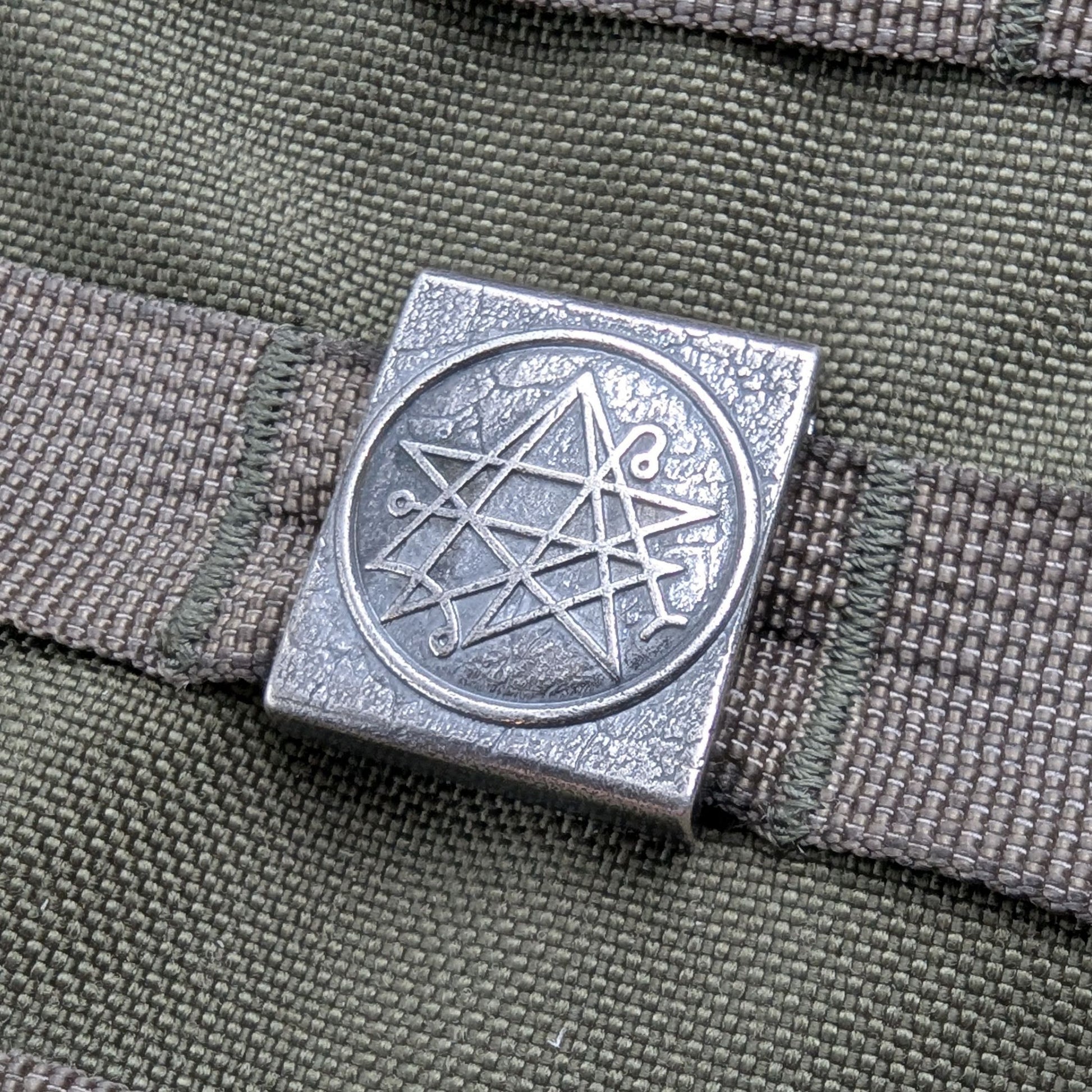 Necronomicon molle clip