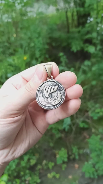 Viking long ship pendant with Vegvisir rune