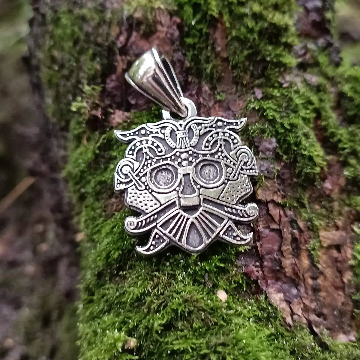Loki mask pendant from silver