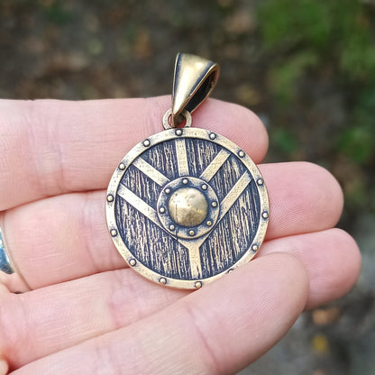 Shield maiden bronze pendant